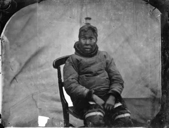 An Elderly Inuk Woman Seated in Chair