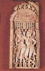 Carved Indian plaque depicting two female figures under a torana, from Begram, Afghanistan