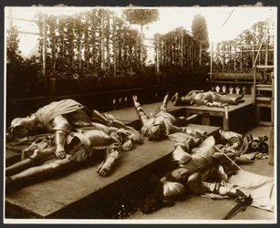 Six Male Models as Ancient Warriors Dressed in Armor Pretending to be Dead