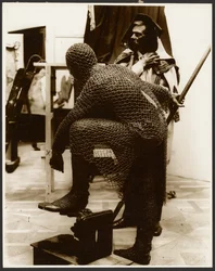 Two Male Models as Ancient Warriors, One Wearing Chain Mail Armor
