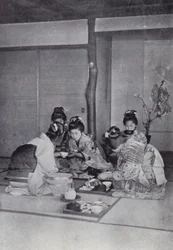 Geishas at dinner in a tea-house