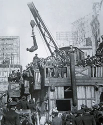 Houdini Escaping from a Strait-Jacket While Suspended from a Crane in New York City
