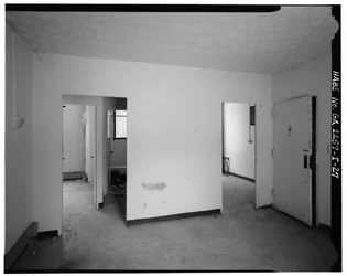 Typical 2-bedroom apartment with entry into den, hallway with bathroom and bedrooms (left), entry to kitchen (right) - Techwood Homes, Building No. 6, 465 Techwood Drive & 119-125 Hunnicutt Street, Atlanta, Fulton County, GA