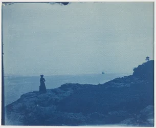 Woman Watching Schooner from a Rocky Promontory