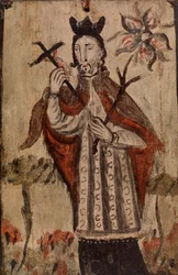 Male Figure holding Cross