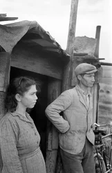 Crotone - Couple on the Door of the House