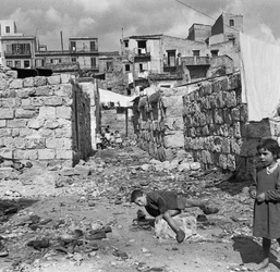 Palermo glimpse of a poor township, where the streets were still covered with rubble, remnant of the 1943 bombing