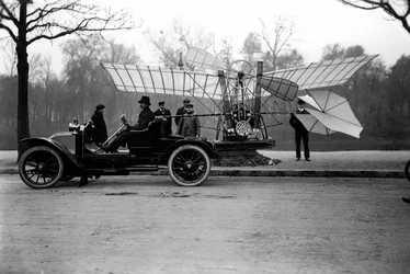 Airman Alberto Santos Dumont carrying his plane in his car. Private Collection
