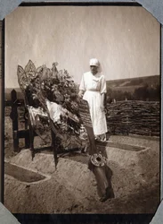 First World War 1914-1918: nurse (Therese Pavillou?) in a blouse on the grave of French pilot sergeant Roux, who died at the age of 21, at Couville, Manche, Lower Normandy, France. Anonymous photograph July 1917. Private collection, Stella