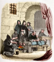 Inquisition in Spain in the 15th century: Mary of Burgundy, accused of being Jewish, is tortured by Peter of Arbues, Spanish inquisitor: he is burning her feet. Illustration in 