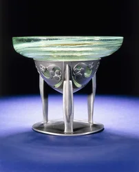 A Liberty Tudric pewter bowl with James Couper & Sons Clutha glass lining, c.1902-05