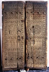 A Pair of Carved Armenian Walnut Doors, Depicting Christ with Six Apostles and Saints