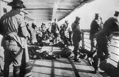 Men of the 3rd Battalion Relaxing on the Deck of the Transport SS Derfflinger Just Before Reveille on the Morning Before the Landing at Anzac Cove, 24 April 1915