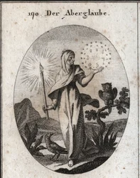 Allegory of superstition. She holds a candle lights and a circle of stars that surrounds the signs of the seven planets that she considers to be anxious. Its attributes are the owl and the crow. Engraving in “Iconologie oder Ideen aus dem Gebiete der Lei