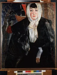 Female Portrait. Beautiful woman with a melancholy face, in the street, her head covered by her scarf, wearing a large black coat, leaning casually, revealing a delicate hand wearing a white mitten. Work by Bo