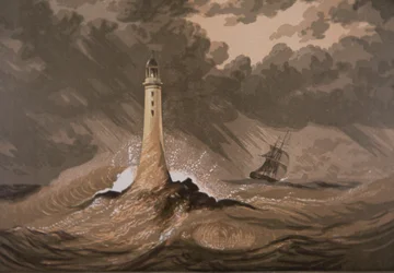 Lighthouse warns ships of rocks in storm at sea