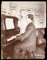 Kyrle Bellew and friend at the piano in Bellew