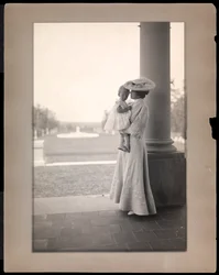 Mrs. Clarence Mackay and child in the portico of Harbor Hill, Long Island 1898-1910