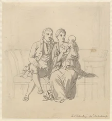 A young couple sitting on a sofa, she with a child in her arms
