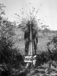 Native American people and tribal roundhouse and ceremonial attire, California