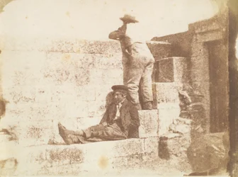 Two Young Men Resting on a Pier