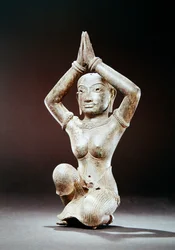 Kneeling female
