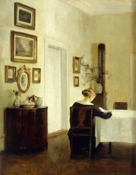 A Woman at a Table in an Interior
