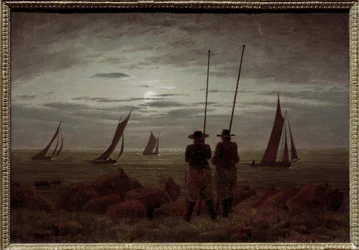 Moonlit night on the beach with fishermen