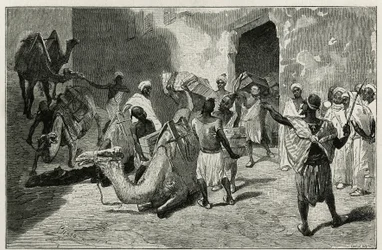 The loading of camels from the caravan of the author of the story, Atanger, engraving by Biseo, to illustrate the story Le Maroc by Edmondo de Amicis, in 1875, published in the tour du monde, under the direction of Edouard Charton