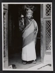 A Ngagpa Holding a Prayer Wheel