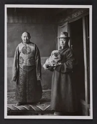 A Monastic Official of Tashilhunpo with Servant and Dog