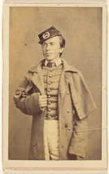 Unidentified Civil War Soldier Standing, One Hand Grasping His Overcoat
