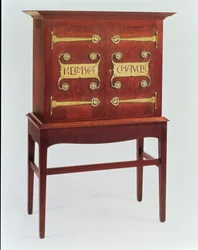 The Kelmscott Chaucer cabinet, designed by C.F.A.Voysey and made by F.Coote