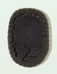 Inkstone carved as the large mythical Lo-shu tortoise among waves