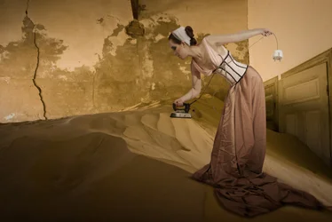 Vintage Woman Ironing Sand