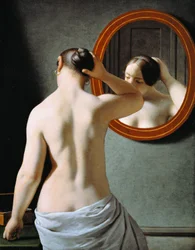 A Nude Woman doing her Hair in front of a Mirror