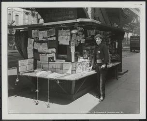 Blind news dealer, P.J. McNulty at his stand at the north east corner of 3rd Avenue & 42nd Street