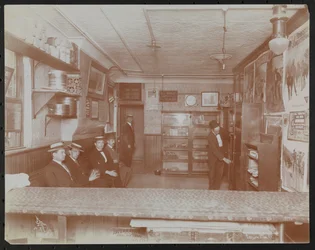 Empire Film Co (Possibly at Broadway and 55th Street) with Movie Posters on Wall and Customers Waiting