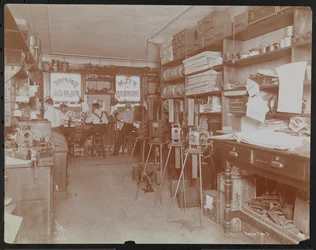Empire Film Co. motion picture laboratory with men working and reels of film and cameras