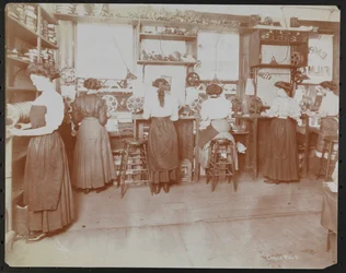 Empire Film Co. motion picture laboratory with men working and reels of film and cameras