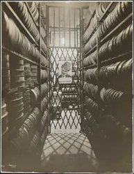 Film storage room at the Mutual Film Co. with poster of Charlie Chaplin, New York