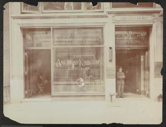 First floor facade of 122-124 E. 25th Street, the Camera Building, American Cinephone Company, American Kinograph Company and doorman, New York