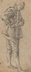 A Standing Man Putting On Armour