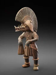 Dancer with crocodile helmet, 300 BC-300 AD