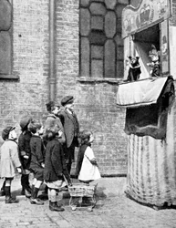 Children Watching a Punch and Judy Show in a London Street, 1936