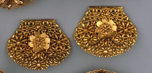 The first typically Northern Dutch-shaped ear-irons openworked and decorated with cornucopia