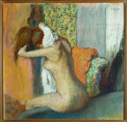 Young woman drying her neck