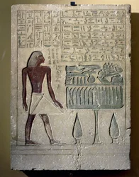 Painted limestone stele depicting Senusret at his offering table