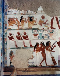 A slave girl assists female guests, while others exchange fruits