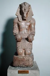 Kneeling statue of Amenhotep II (1427-1392 BC) holding offerings of wine, from Thebes, New Kingdom, c.1450-1425 BC (granite)